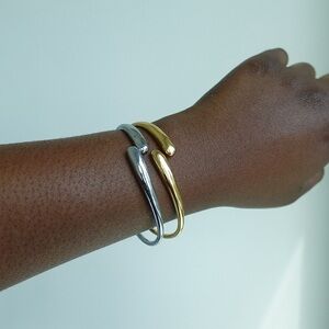 Gold plated bangles. Comes in a pair of gold and silver